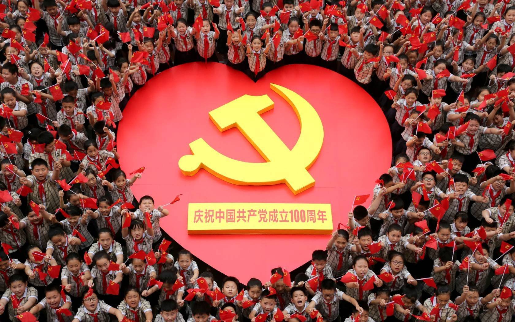 Primary school students sing together to celebrate the hundredth anniversary of the founding of the Communist Party of China (CPC) in Zaozhuang, Shandong Province, China, June 22, 2021. Credit: Costfoto/Barcroft Media via Getty Images
