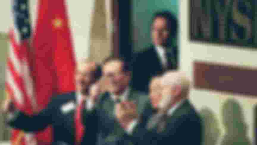 Chinese president Jiang Zemin opens trading on the New York Stock Exchange, October 1993. Credit: Timothy A. Clary / AFP via Getty Images.