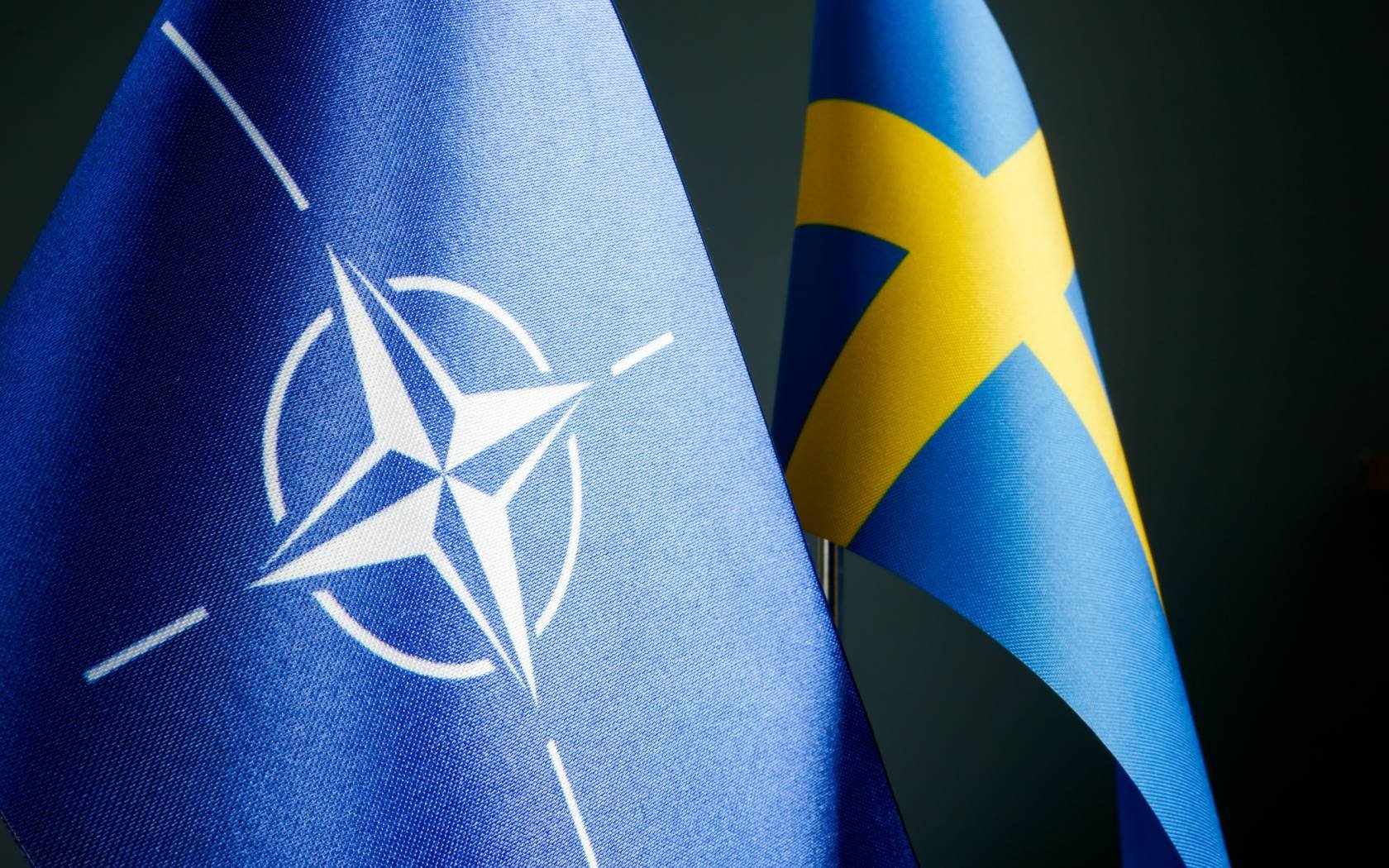 Close-up of the flags of Sweden and NATO.